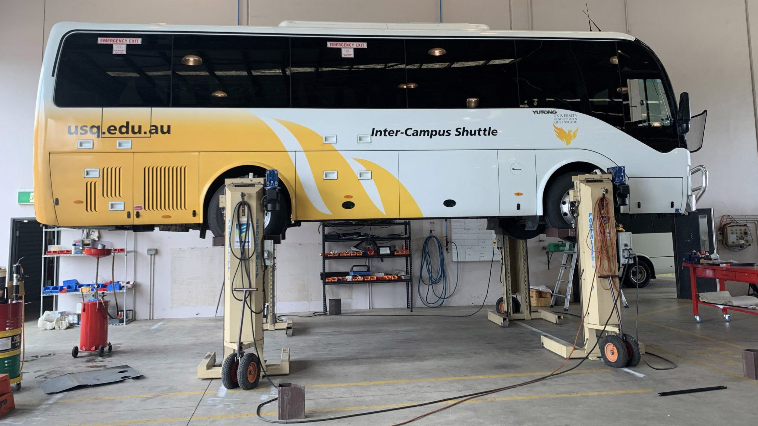 Brisbane global fleet maintenance bus and truck engineering servicing 1-bus yutong repairs mechanical workshop repairs bus hoist